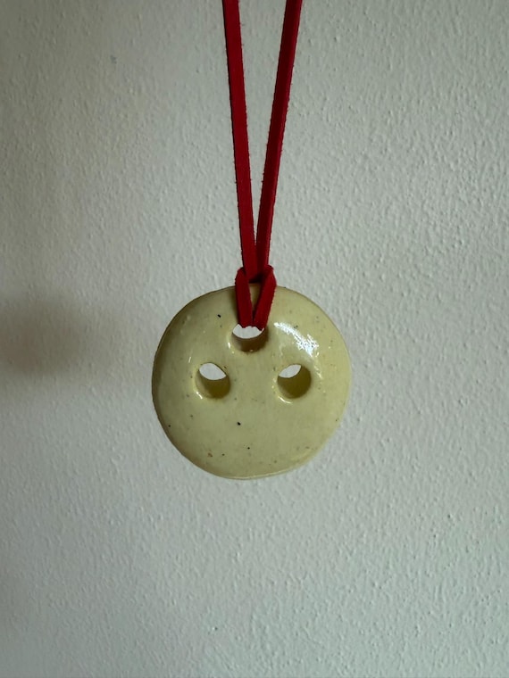 Ceramic pendant necklace with faux suede cord
