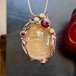 Large rutilated quartz, red garnet, Ethiopian opal pendant in sterling silver and rose gold, Boho-hippie necklace
