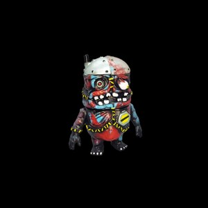 May include: A small, red, blue, and silver robot toy with a stitched-up face and a yellow warning sign on its chest.