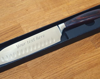 Personalised Engraved Japanese Santoku kitchen blade. 7 Inch Blade with Wooden Handle. Comes in Black Presentation Box. Engrave any name.