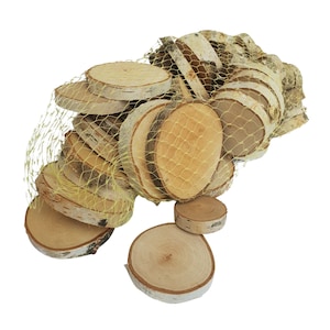 May include: A pile of natural birch wood slices in a yellow mesh bag. The slices are various sizes and shapes, with the bark still attached to some.