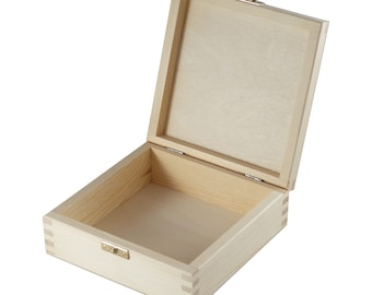 May include: An empty wooden box with a hinged lid and a metal latch. The box is made of light-colored wood and has a natural finish.