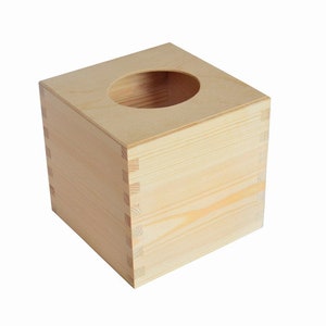 May include: A plain wooden tissue box cover with a square shape and a round opening on the top.