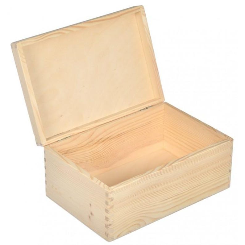 May include: An open, unfinished wooden box with a hinged lid. The box is rectangular with dovetail joints at the corners. The lid is slightly ajar, revealing the interior of the box. The wood grain is visible throughout the box.