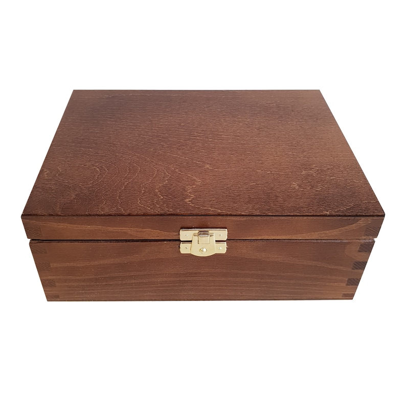 May include: A wooden box with a hinged lid and a brass latch. The box is a dark brown color and has a smooth finish.