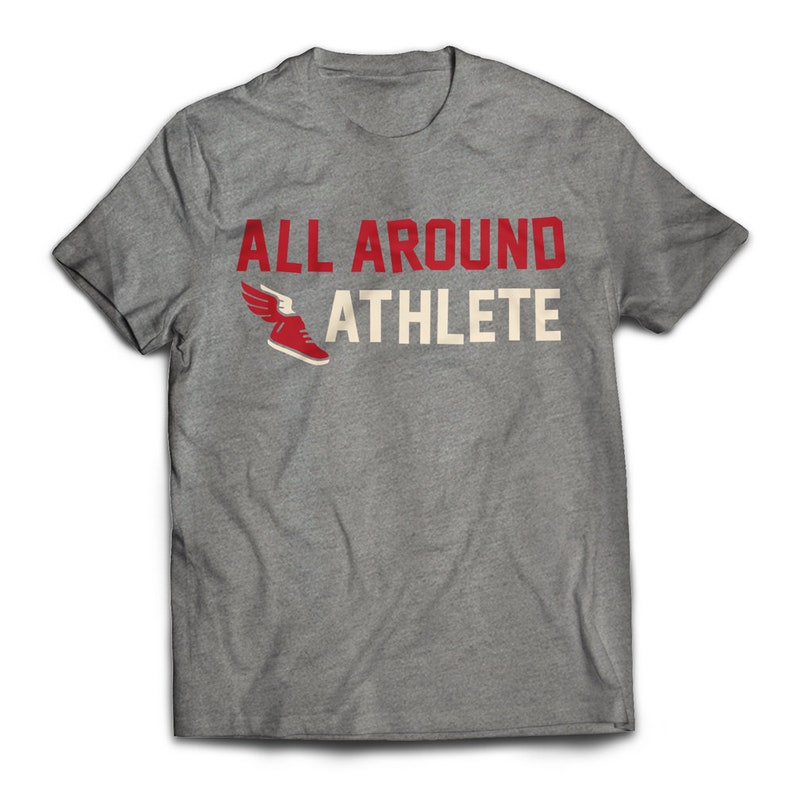 May include: Gray t-shirt with the text "ALL AROUND ATHLETE" in red and white lettering. A red running shoe with a white wing is next to the text.