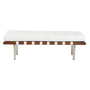 May include: A white leather bench with a wooden frame and chrome legs. The bench has a tufted design and is supported by a series of leather straps.
