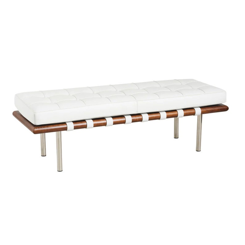 May include: White leather bench with a wooden frame and metal legs. The bench has a tufted design and is supported by a series of leather straps.