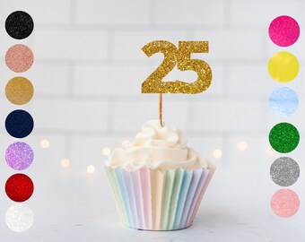 May include: Gold glitter number 25 cake topper on a pastel striped cupcake.