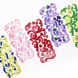 May include: Five sheets of colorful stickers featuring different fruits and vegetables. Each sheet has a unique design with swirls and shapes. The colors are bright and vibrant, including pink, red, purple, green, and yellow.