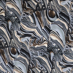 May include: Abstract pattern with swirling lines in shades of brown, black, and blue. The pattern resembles a marble or agate stone.
