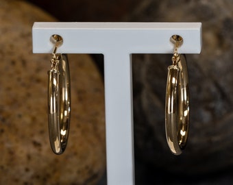 Aretes tipo argolla de oro amarillo de 14 quilates de 18 mm