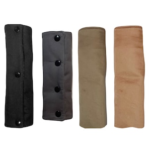 May include: Four fabric covered armrests in black, gray, beige, and brown. Each armrest has three black buttons.