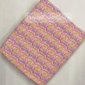 May include: Pink fabric with a repeating pattern of yellow stylised flowers with blue stems. The fabric has a subtle sheen.