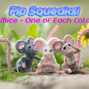 May include: Three crocheted mice, one gray, one white, and one brown, with pink ears and noses, are sitting in a grassy area with a dandelion in the background. The text "Pip Squeaks! 3 Mice - One of Each Color" is above the mice.