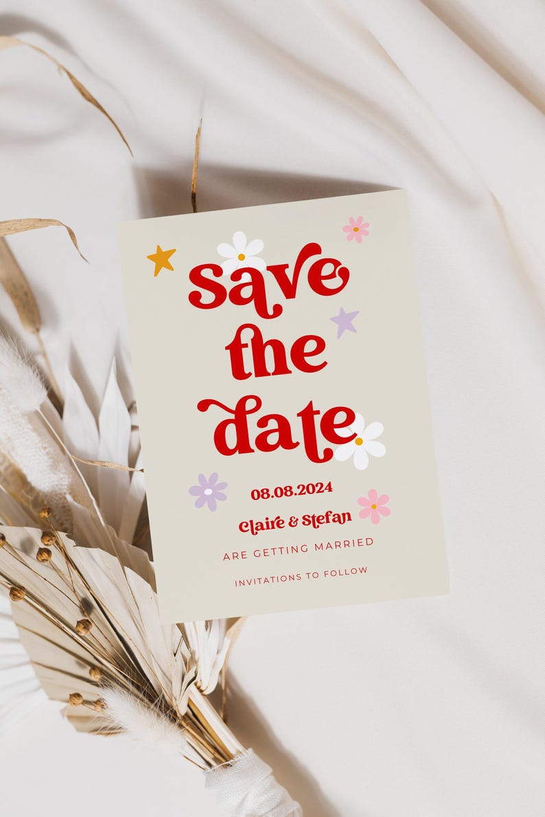 Beige save the date cards with red retro writing