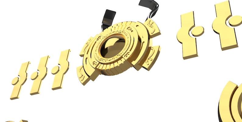 May include: A gold-colored metal puzzle with intricate details. The puzzle is made up of several interlocking pieces, and it appears to be a complex and challenging design.