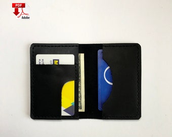 May include: A black leather wallet with two card slots and a cash pocket. The wallet is open and shows a credit card, a gift card, and cash.