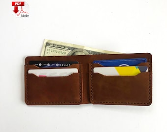 May include: A brown leather wallet with two card slots and a cash pocket. The wallet is open and has a dollar bill and two credit cards inside.