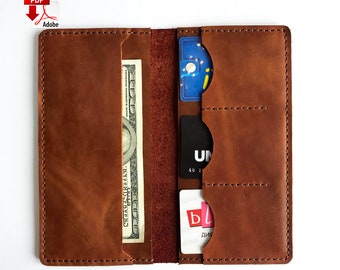 May include: A brown leather wallet with multiple card slots and a cash pocket. The wallet is open and shows a dollar bill and several cards.
