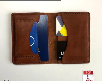 May include: A brown leather wallet with multiple card slots and a cash pocket. The wallet is open and shows the interior. The text "IT IS A DIGITAL PDF PATTERN. SUITABLE FOR HANDMADE." is visible above the wallet.