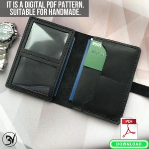 May include: A black leather wallet with multiple pockets and slots for cards and cash. The wallet is open and shows the interior, which has a blue and green card inside. The text "VISA" is visible on the card. The wallet is labeled "PDF DOWNLOAD".