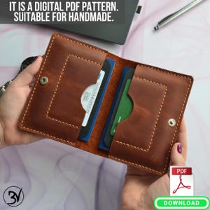May include: A brown leather wallet with two card slots and a flap closure. The wallet is open and shows two cards inside. The text "UKRAINE" is visible on one of the cards. The image includes the text "IT IS A DIGITAL PDF PATTERN. SUITABLE FOR HANDMADE." and a download icon.