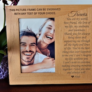 May include: A wooden picture frame with a personalized message engraved on the front. The message reads "Travis You are my world, best friend, the love of my life, my soulmate, and teammate. Thank you for always being there and supporting me through all the highs and lows of life. You're the best thing that ever happened to me and I can't imagine my life without you. I can't wait to continue making amazing memories together. I love you now and always will. Alexis".