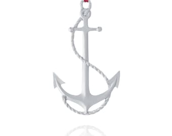 May include: A silver anchor ornament with a rope detail, hanging from a red ribbon.