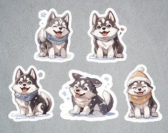 May include: Set of five stickers featuring cartoon husky dogs. Each sticker shows a smiling husky with black, white, and gray fur, wearing a scarf or hat. Some stickers have snowflakes or a heart.