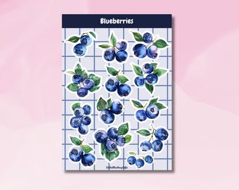 May include: A sheet of stickers featuring 12 watercolor illustrations of blueberries. The stickers are on a white background with a blue grid pattern. The text "Blueberries" is at the top of the sheet.