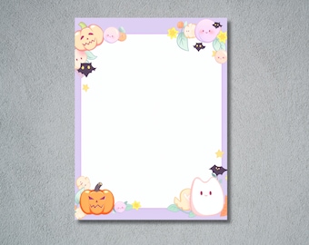May include: A lavender-bordered stationery sheet with Halloween-themed illustrations. The corners feature cartoon pumpkins, ghosts, bats, stars, and other cute, colorful elements. The center is blank, providing space for writing or drawing.