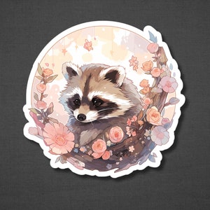 Puede incluir: Un adorable mapache de dibujos animados rodeado de flores rosas y blancas. El mapache est&aacute; sentado en una rama con un fondo suave y de ensue&ntilde;o.