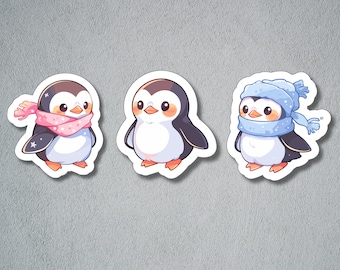 May include: Three cartoon penguin stickers with different colored scarves. The first penguin is wearing a pink scarf with white polka dots. The second penguin is wearing a blue scarf with white polka dots. The third penguin is wearing a blue hat with white polka dots and a blue scarf with white polka dots.