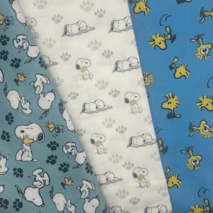 Snoopy and Woodstock Fabrics 100% cotton. Also sold by the half yard or full yards.