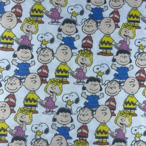 Peanuts Fabric. 100% cotton. Also sold by the half yard or full yards.