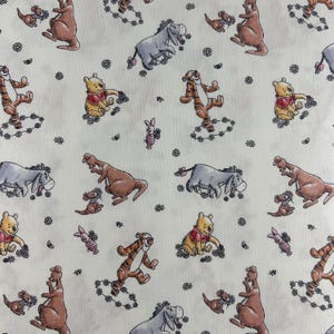 Winnie the Pooh Fabric. 100% cotton. Also sold by the half yard or full yards.
