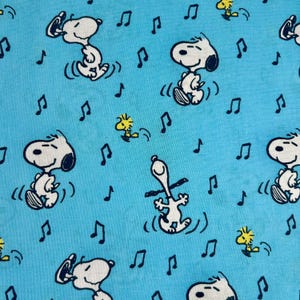 Snoopy and Woodstock Music Fabric. 100% cotton. Also sold by the half yard or full yards.