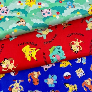 May include: Three stacked layers of fabric featuring various cartoon characters. The top layer is green with clouds and flowers. The middle layer is red with character names like Pikachu, Squirtle, and Meowth. The bottom layer is blue with characters and Poké Balls.
