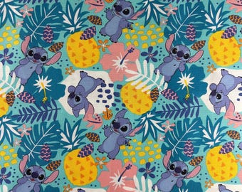 Lilo and Stitch Fabric 100% cotton. Also sold by the half yard or full yards.