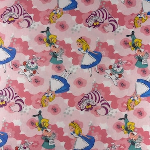 Alice in Wonderland Fabric 100% cotton. Also sold by the half yard or full yards.