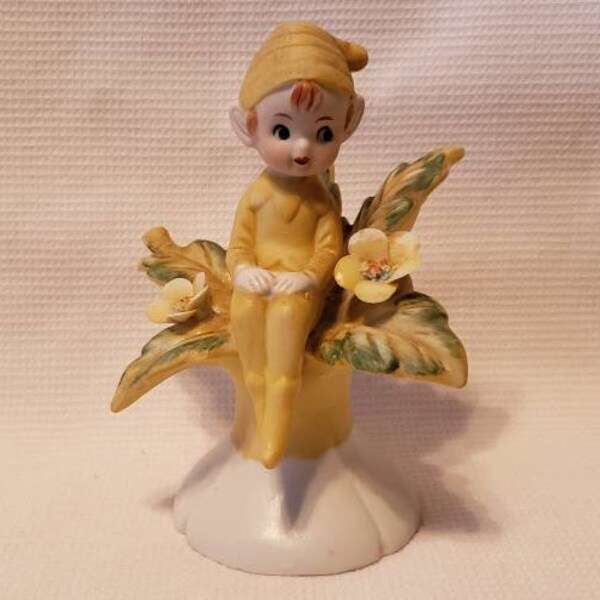 Vintage Bisque Porcelain Pixie Gnome Elf Figurine Sitting on Flower Blooms Mid-Century Collectible