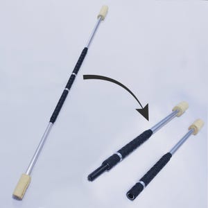 May include: A silver fire staff with black grip tape and tan wicks. The image shows the staff assembled and disassembled, with an arrow indicating how it comes apart.