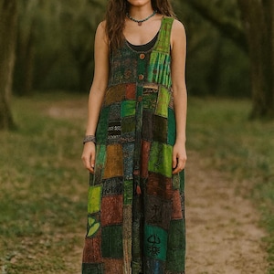 May include: A sleeveless patchwork dress in shades of green, brown, and blue. The dress has a button-down front and a variety of geometric and patterned fabric squares. The model is wearing a headband and necklace.
