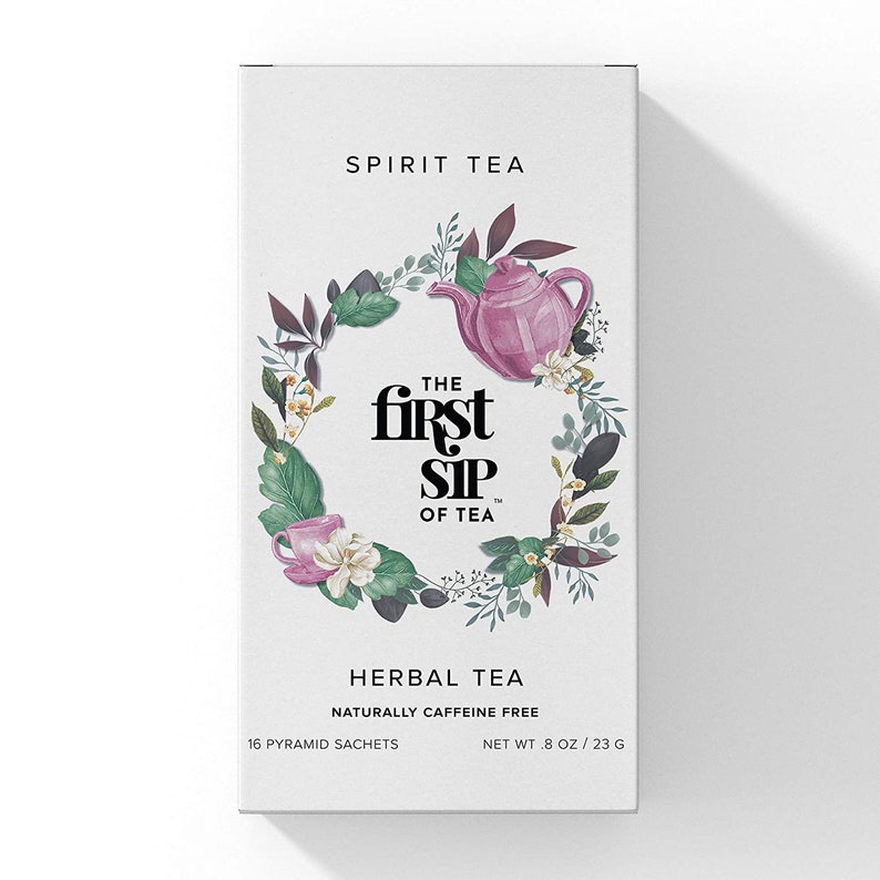 May include: A box of Spirit Tea Herbal Tea, naturally caffeine free. The box features a floral design with a teapot and cup, and the text "The First Sip of Tea". It contains 16 pyramid sachets and weighs 8 ounces or 23 grams.