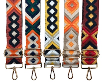 May include: Five colorful woven straps with gold metal clasps and hooks. The straps have geometric patterns in shades of orange, red, black, white, and green.