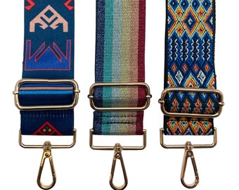 May include: Three adjustable straps with gold hardware and different patterned designs. The straps are blue, red, and yellow with geometric patterns.