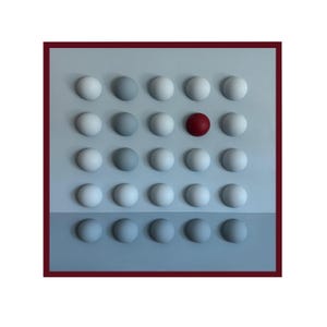 May include: Abstract wall art featuring a grid of 20 spherical shapes. The spheres transition in color from light gray to dark gray, with one red sphere. The artwork is set against a light gray and blue background, framed by a dark red border.