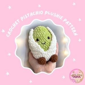 May include: A crocheted pistachio plushie pattern. The plushie is green with a smiling face, wrapped in a white shell, and has brown feet. The text "CROCHET PISTACHIO PLUSHIE PATTERN" is in a circular design around the plushie.