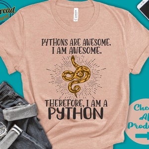 May include: A light pink t-shirt featuring a snake graphic with the text "Pythons are awesome. I am awesome. Therefore, I am a Python."